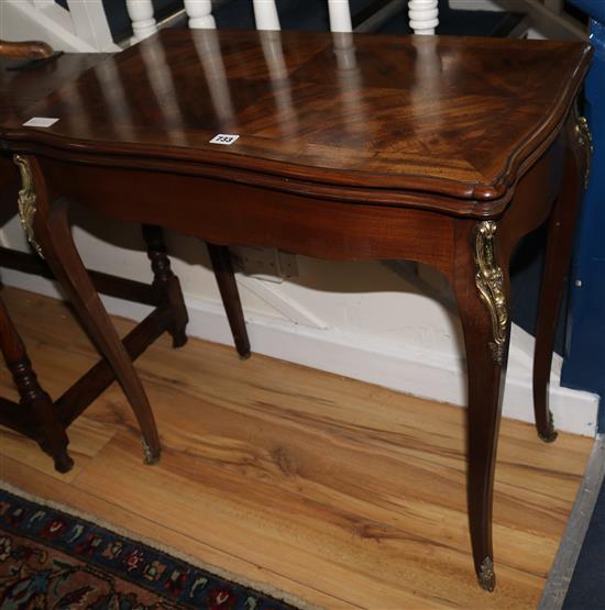 A Louis XVI style mahogany card table, W.76cm
